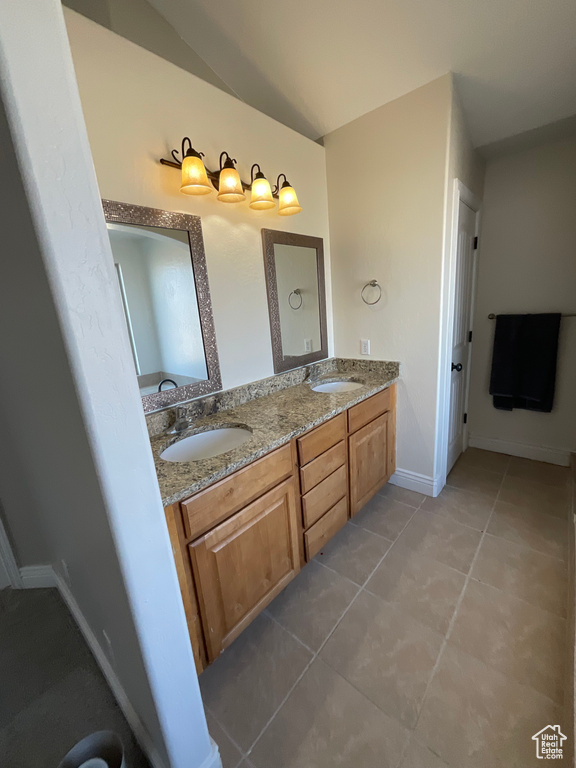 Bathroom featuring vanity and tile patterned floors