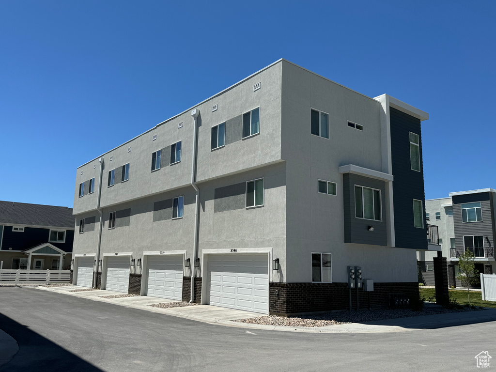 View of building exterior with a garage