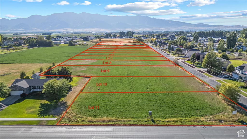 Birds eye view of property with a rural view and a mountain view