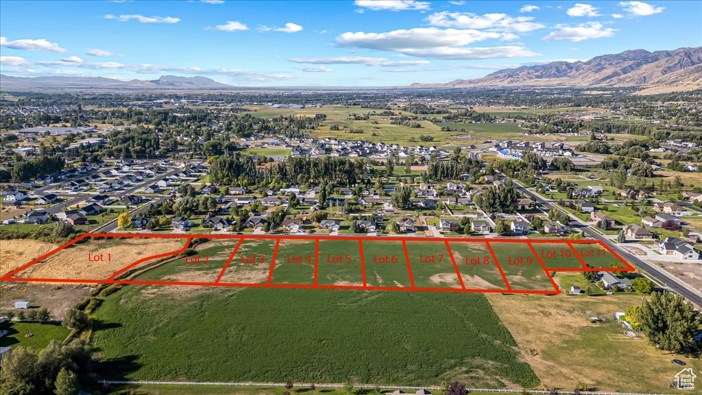 Birds eye view of property with a mountain view