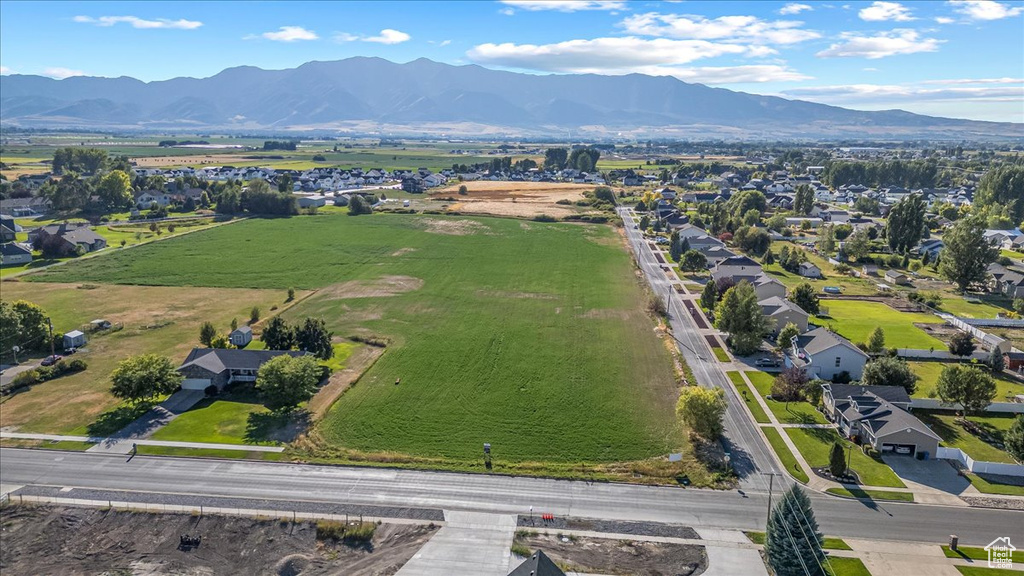 Birds eye view of property with a mountain view