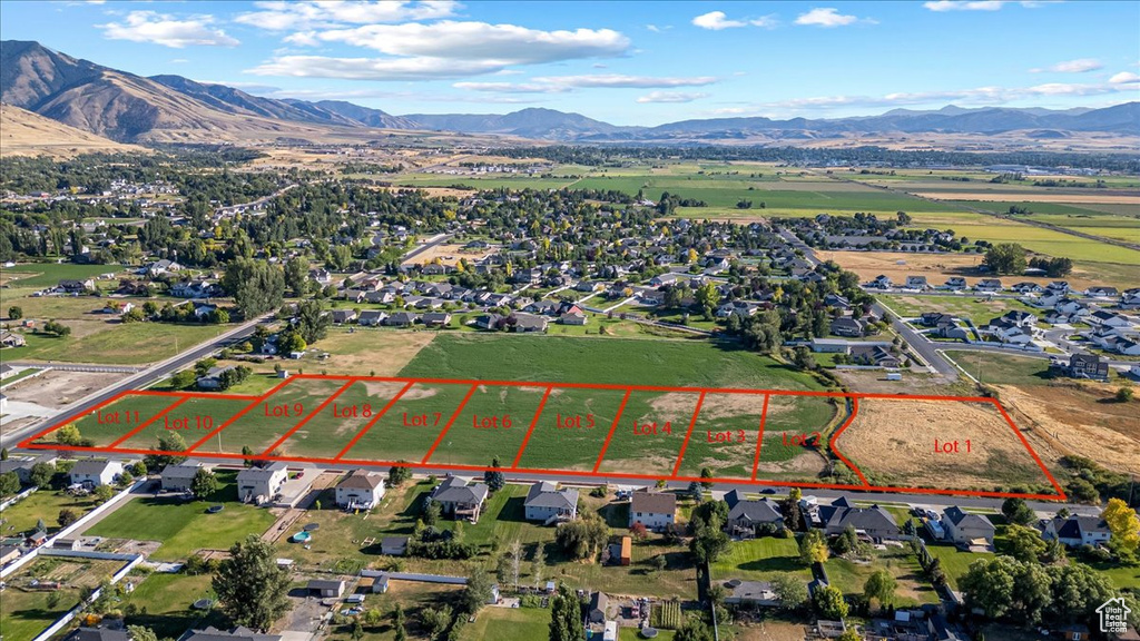 Aerial view featuring a rural view and a mountain view