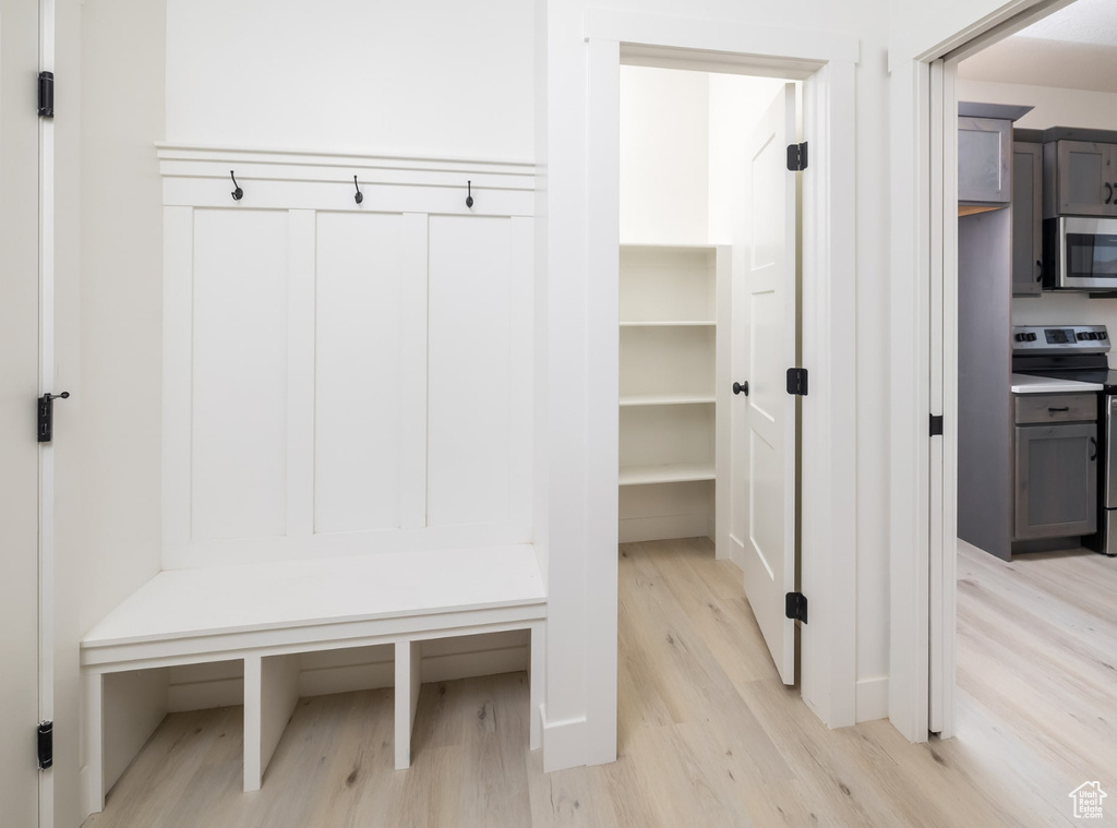 Mudroom with light hardwood / wood-style flooring