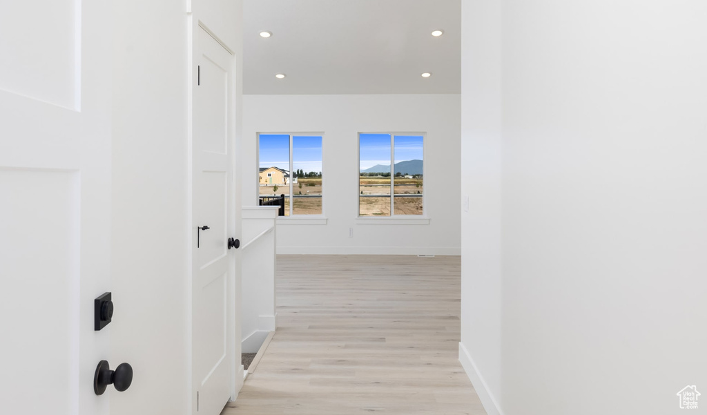 Hall featuring light wood-type flooring