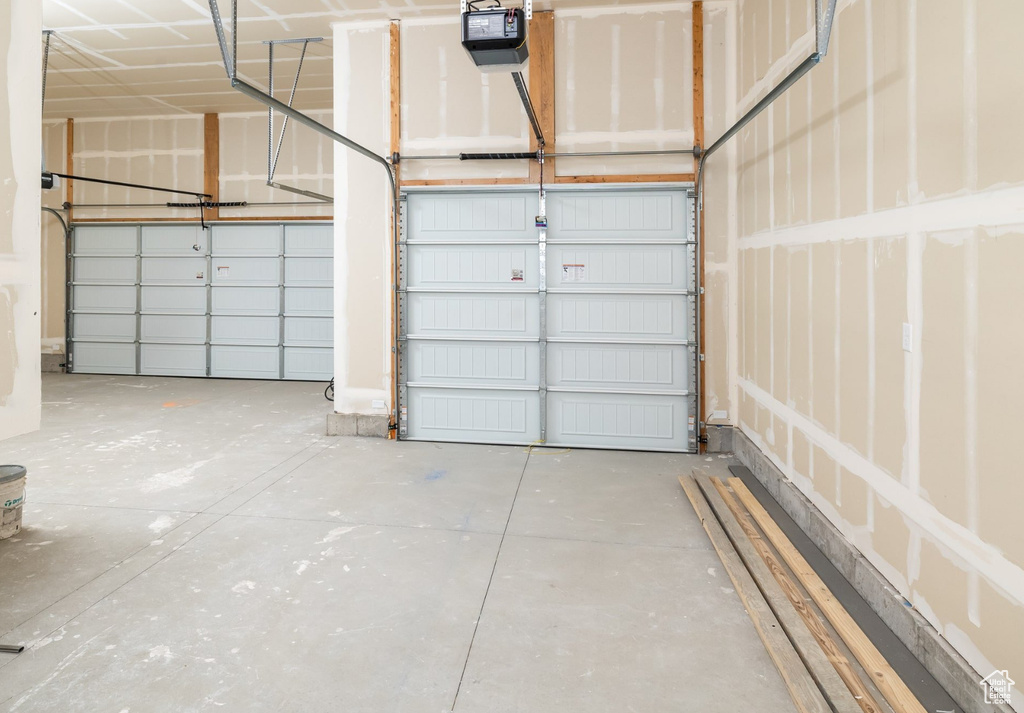 Garage featuring a garage door opener