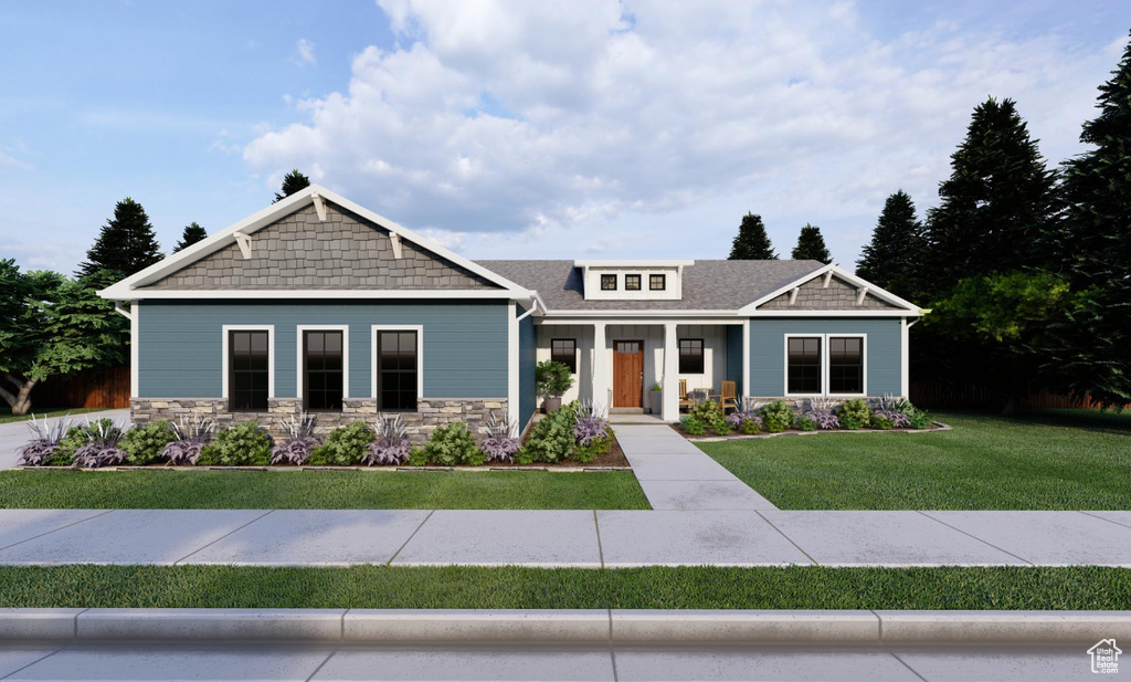 Craftsman-style house with a front yard