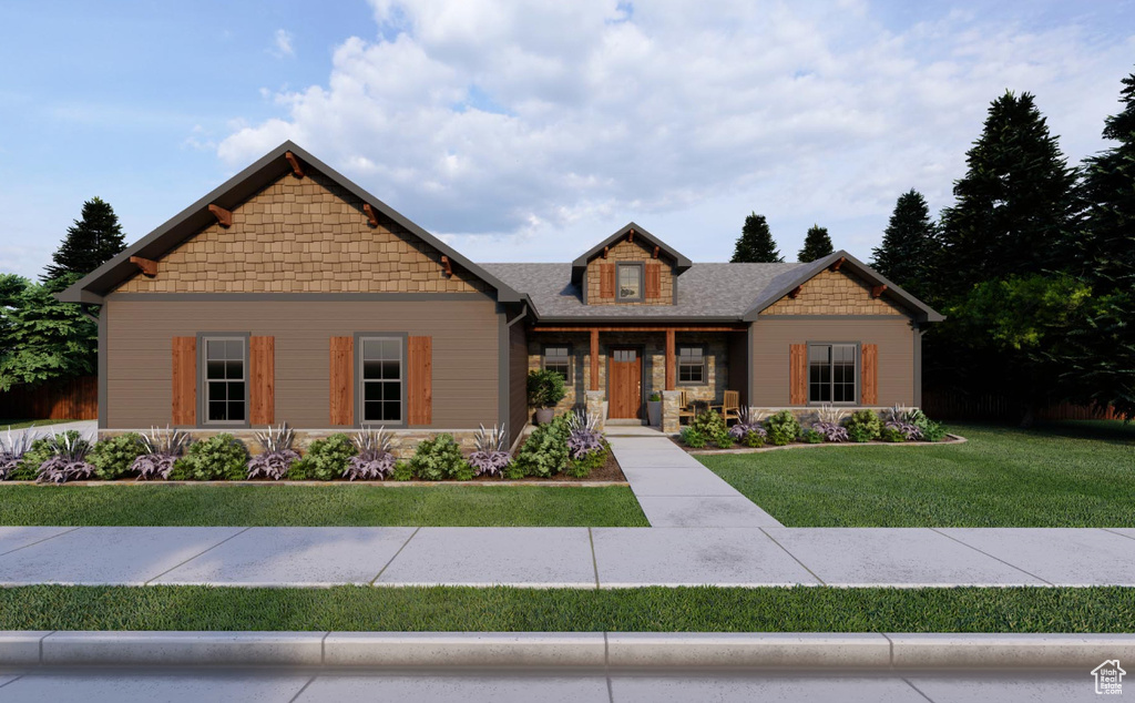 Craftsman-style home with a front yard