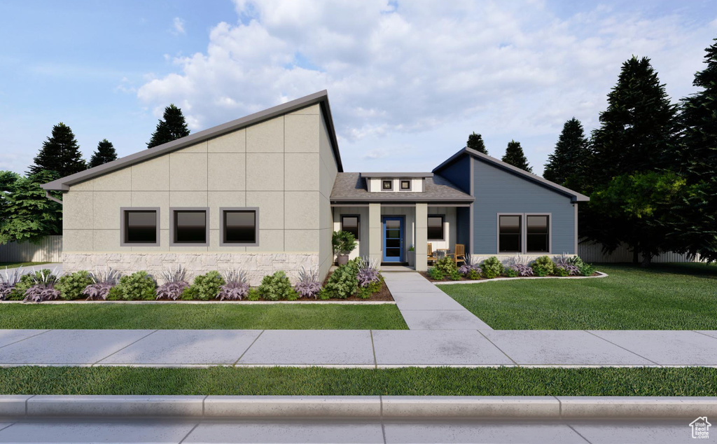 View of front facade featuring a front yard