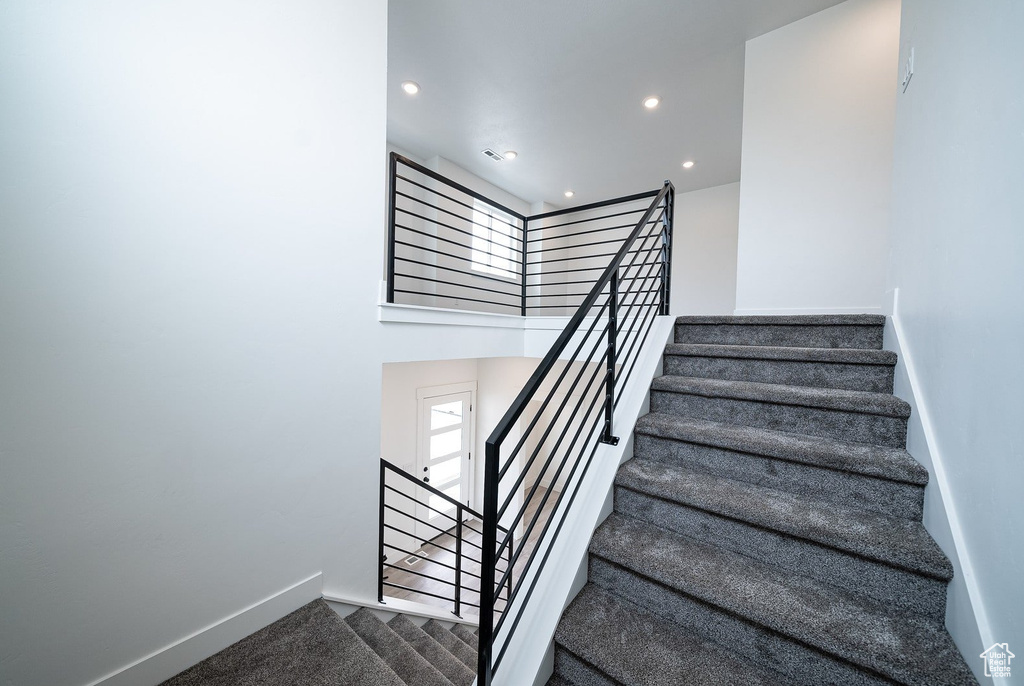 Stairway featuring carpet