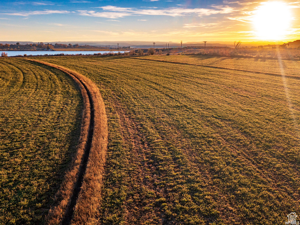 Aerial view at dusk featuring a rural view