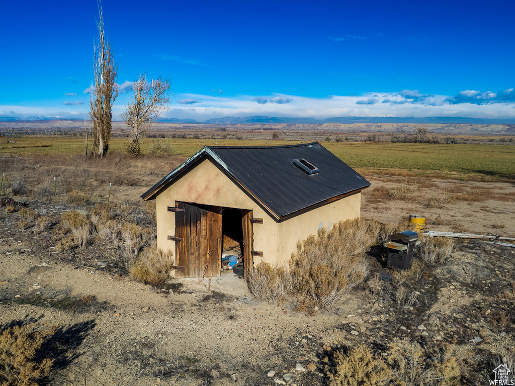 View of outdoor structure with a rural view