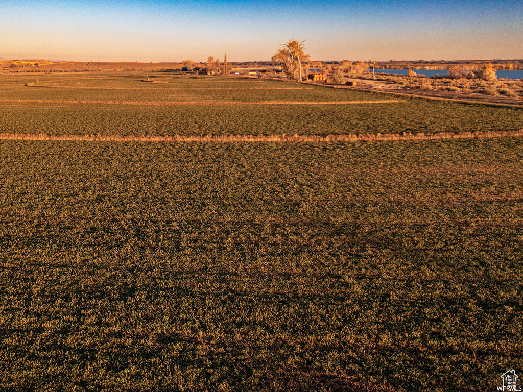 Aerial view at dusk featuring a rural view