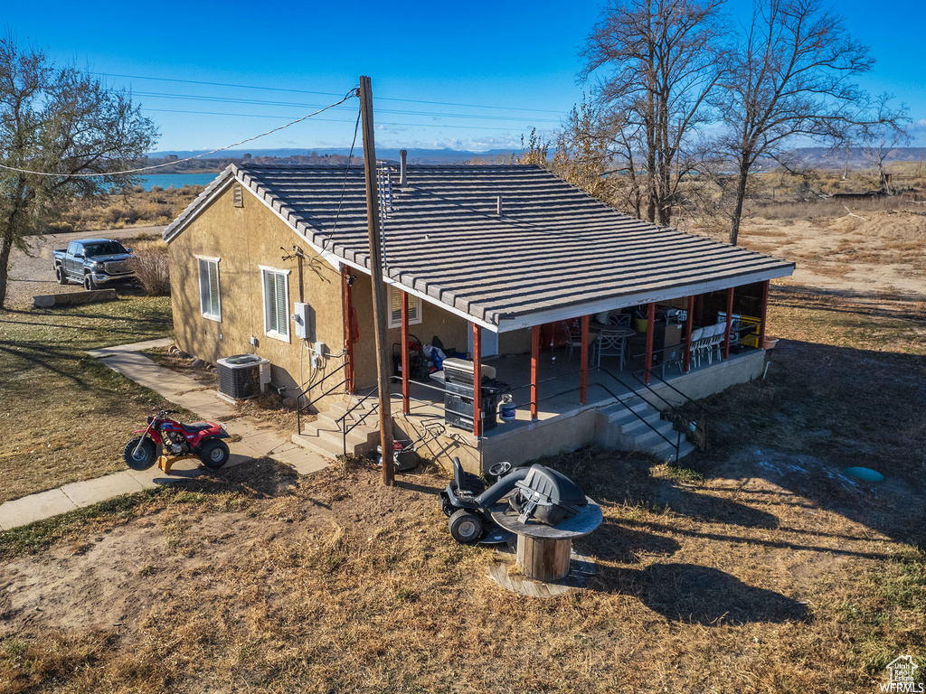 View of front of property with central AC unit