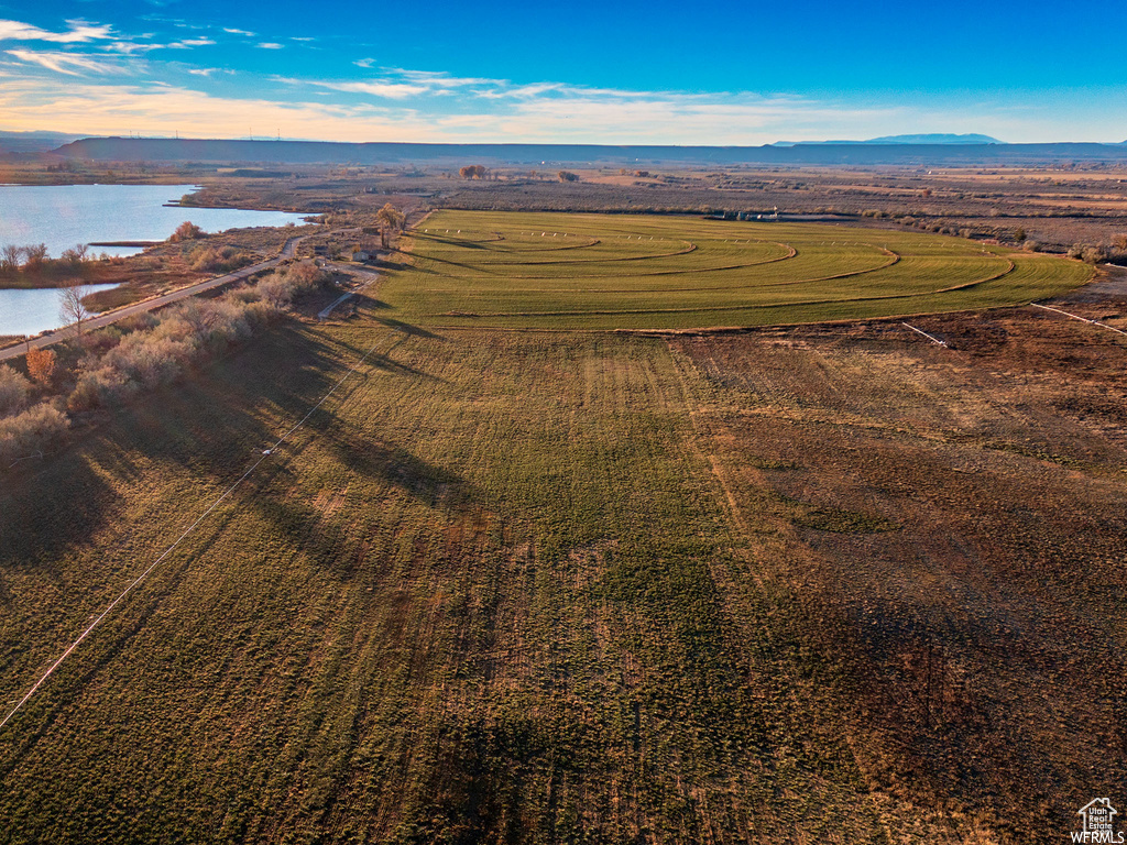 Drone / aerial view with a water and mountain view