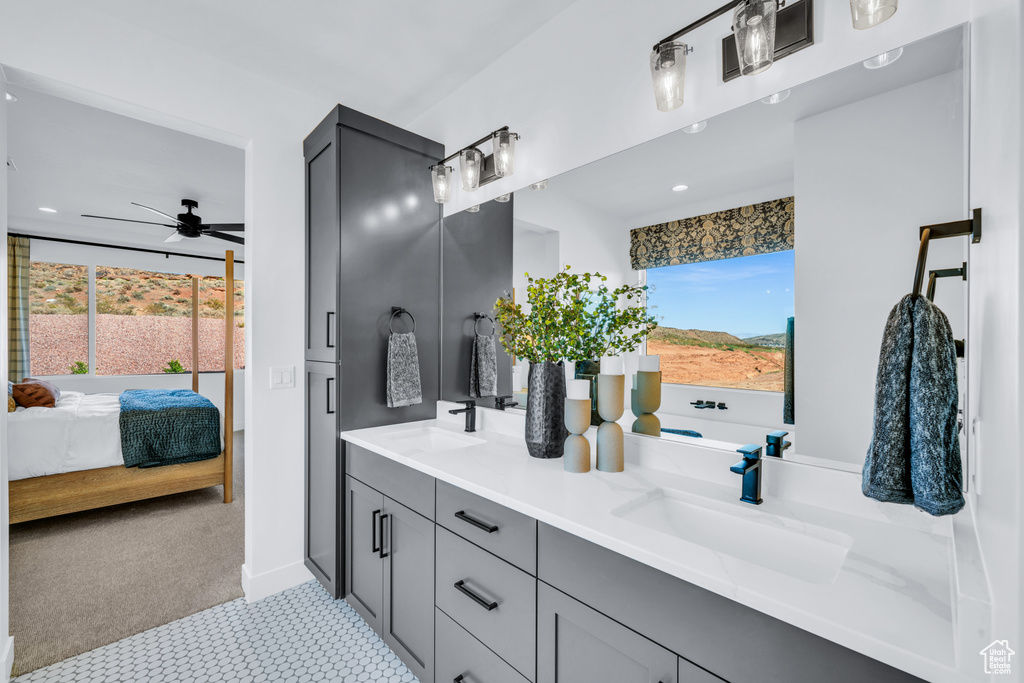 Bathroom featuring vanity and ceiling fan