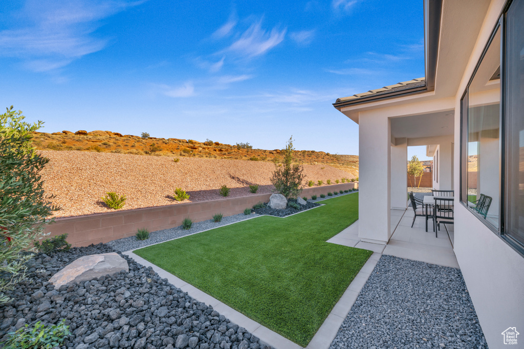 View of yard with a patio area