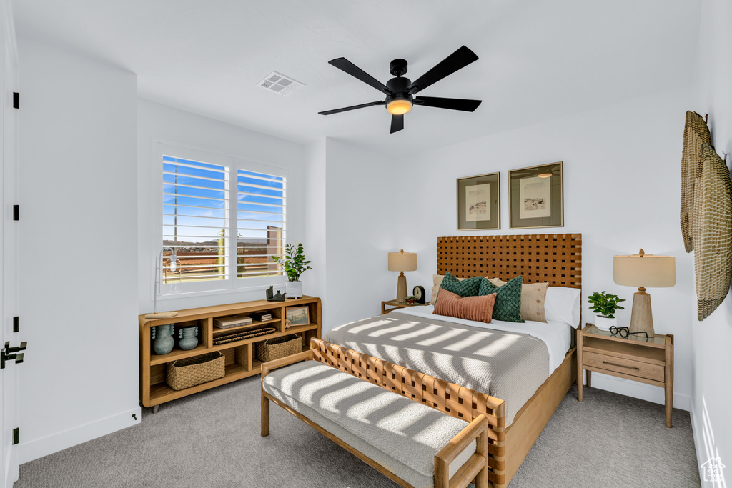 Bedroom featuring light carpet and ceiling fan