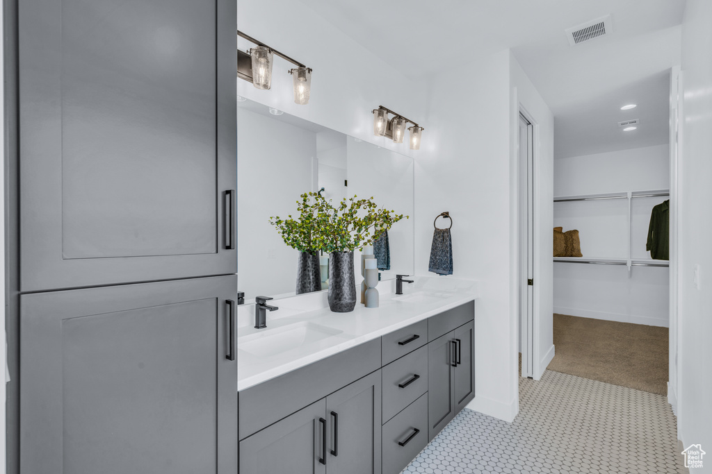 Bathroom with vanity and tile patterned flooring