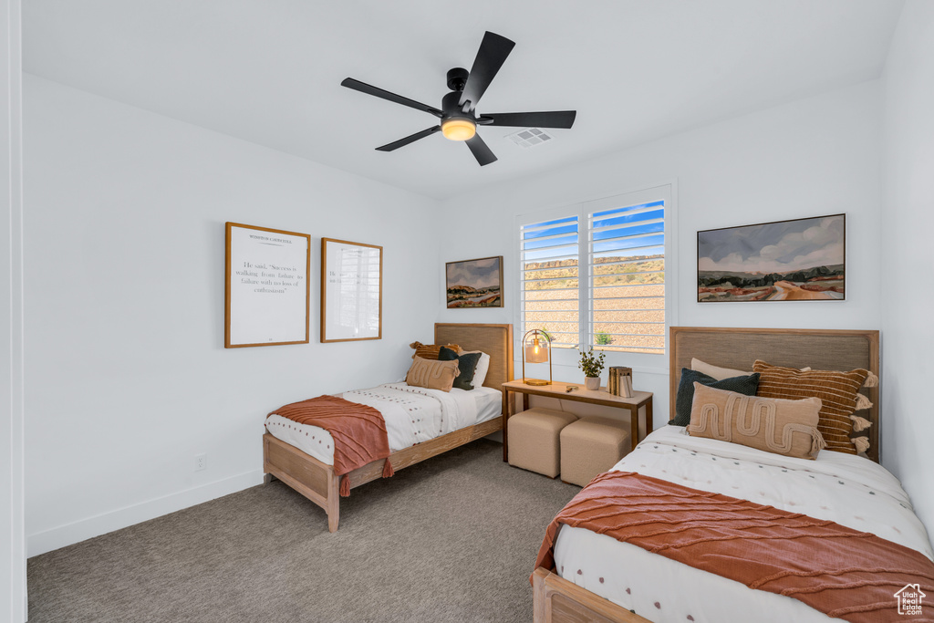 Bedroom with ceiling fan and carpet flooring