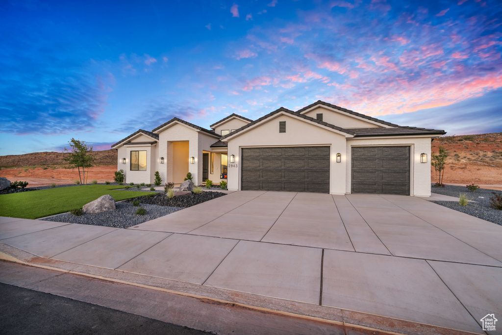 View of front of property featuring a garage