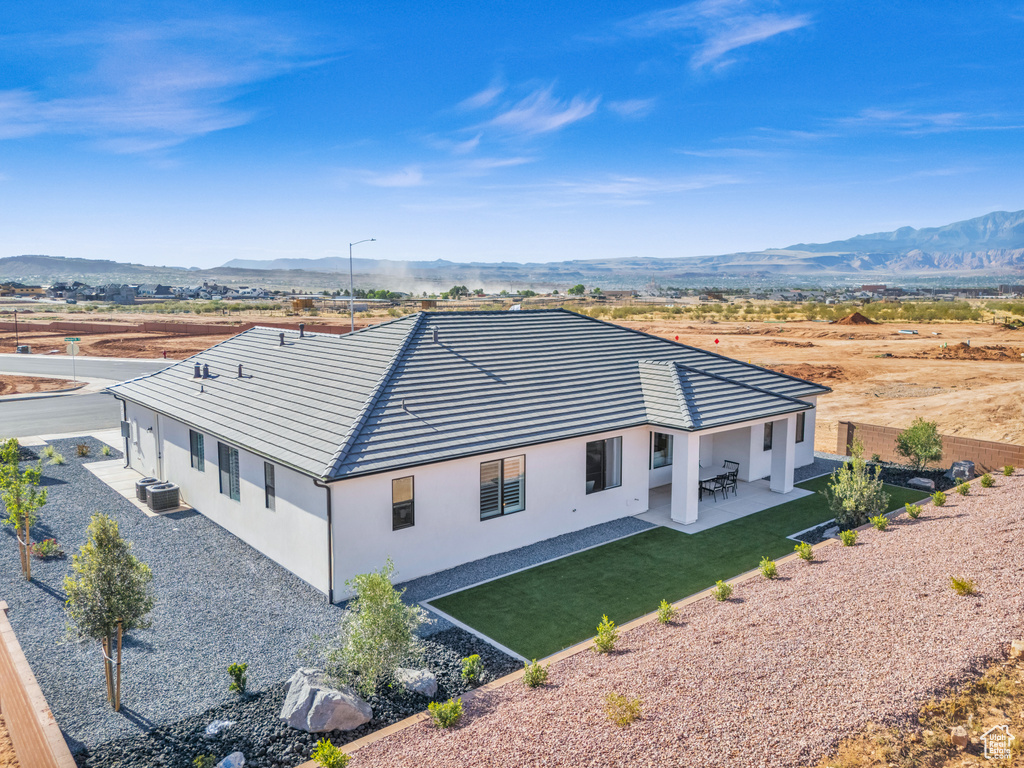 Birds eye view of property with a mountain view