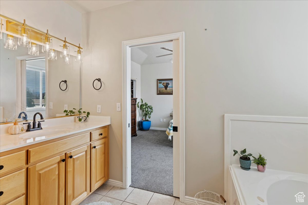 Bathroom featuring tile patterned floors and vanity