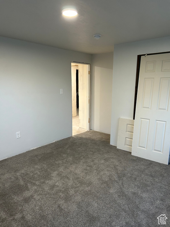 Spare room featuring carpet floors