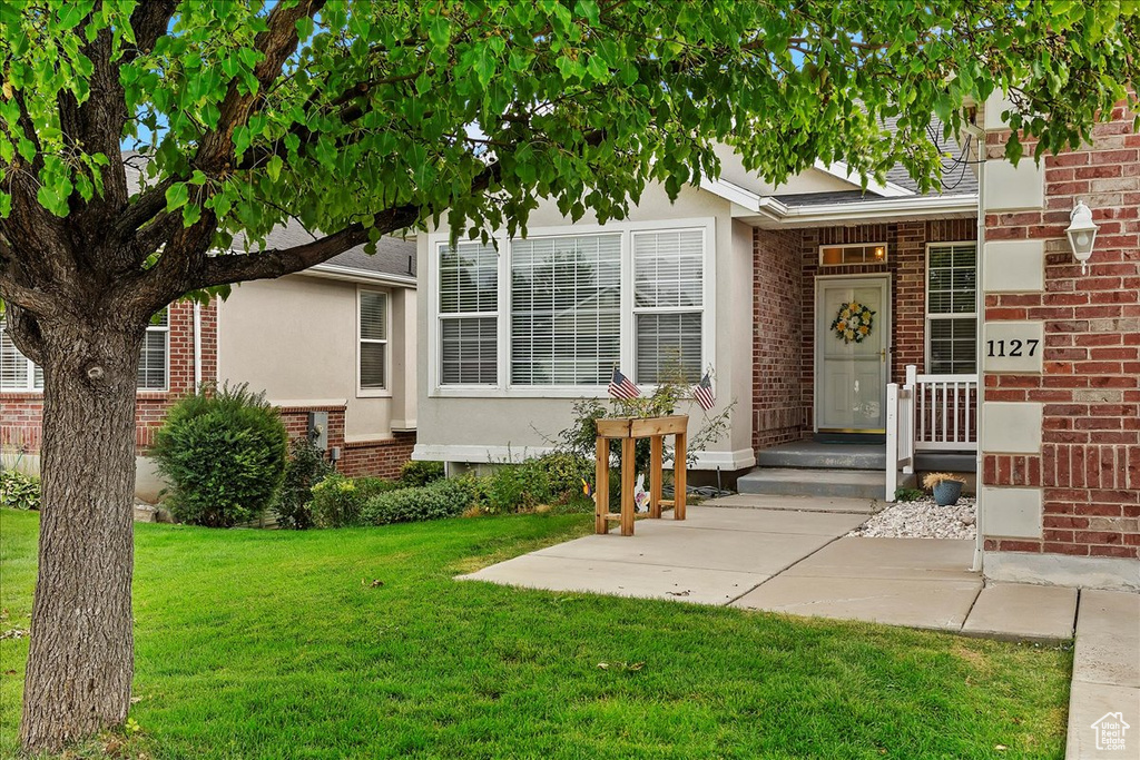 View of front of property with a front lawn