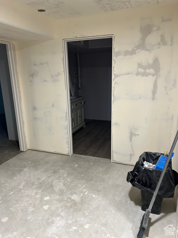 Hallway with hardwood / wood-style flooring