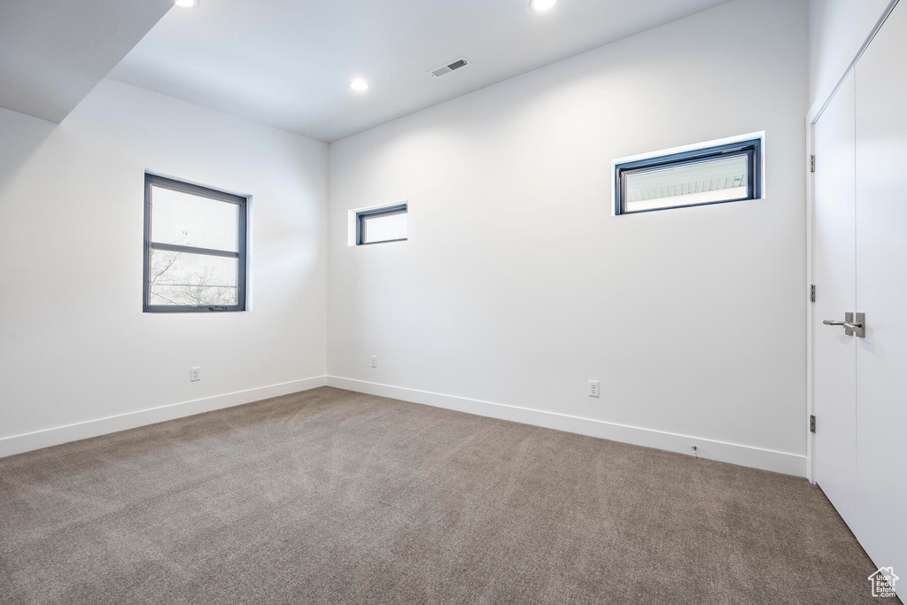 Spare room featuring light colored carpet