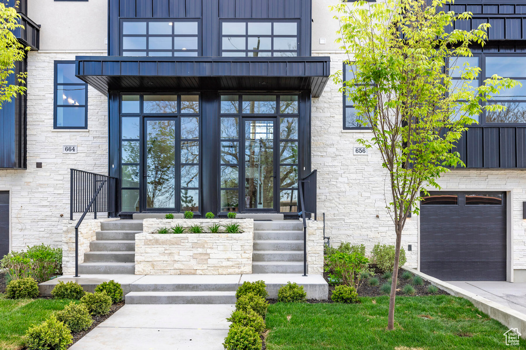 Entrance to property featuring a garage