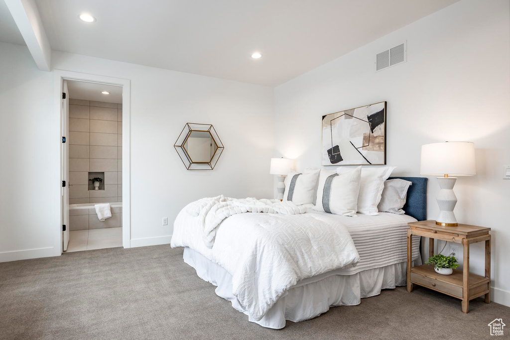 Carpeted bedroom with ensuite bathroom