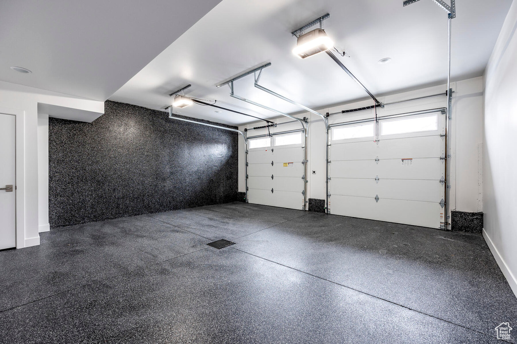 Garage featuring a garage door opener