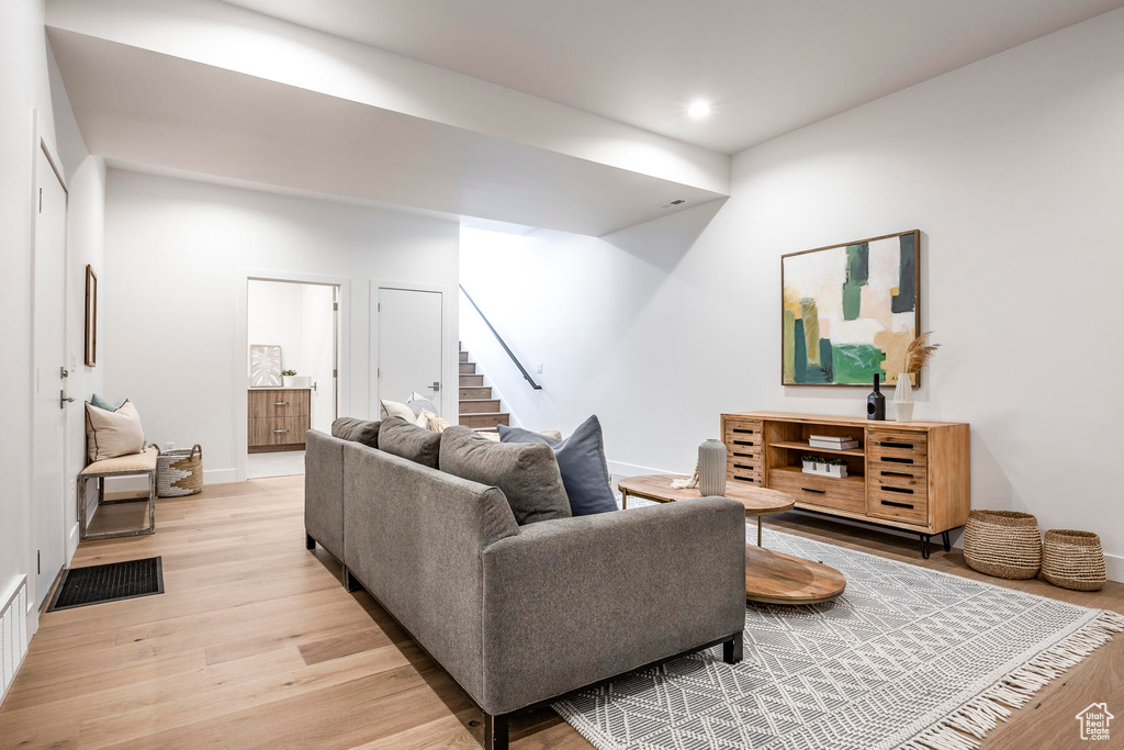 Living room with light hardwood / wood-style floors