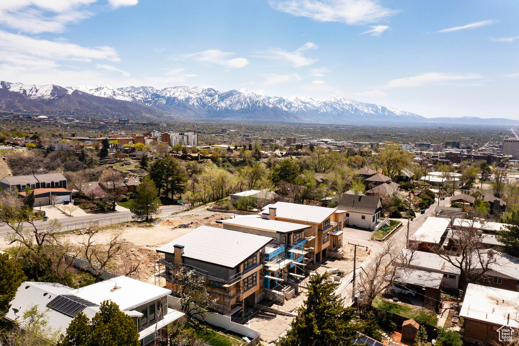 Birds eye view of property with a mountain view