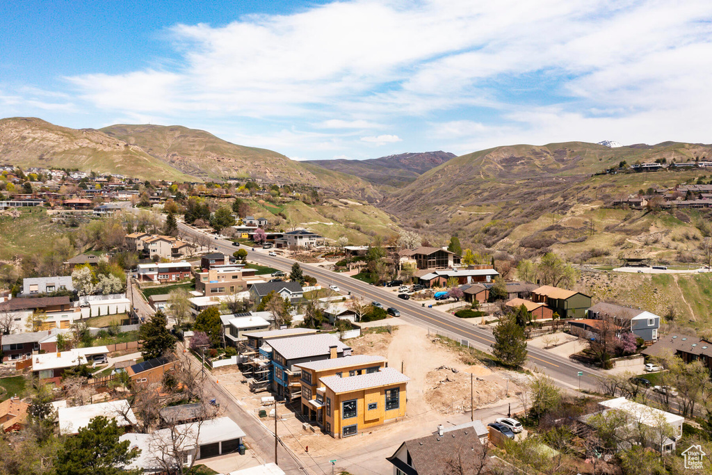 Birds eye view of property with a mountain view