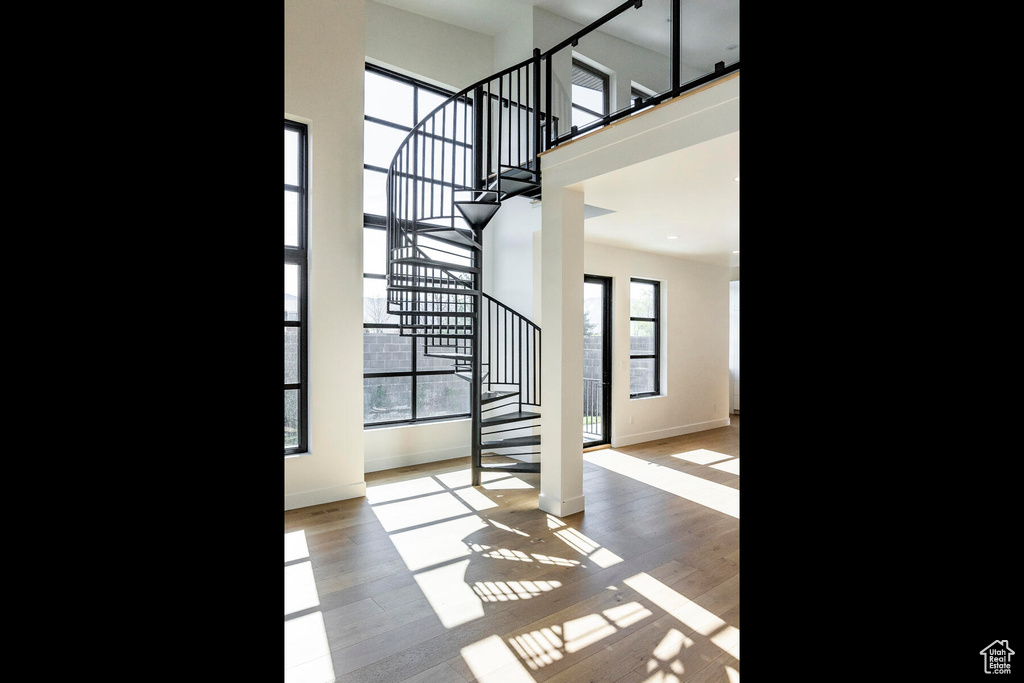 Foyer featuring a high ceiling and light wood-type flooring