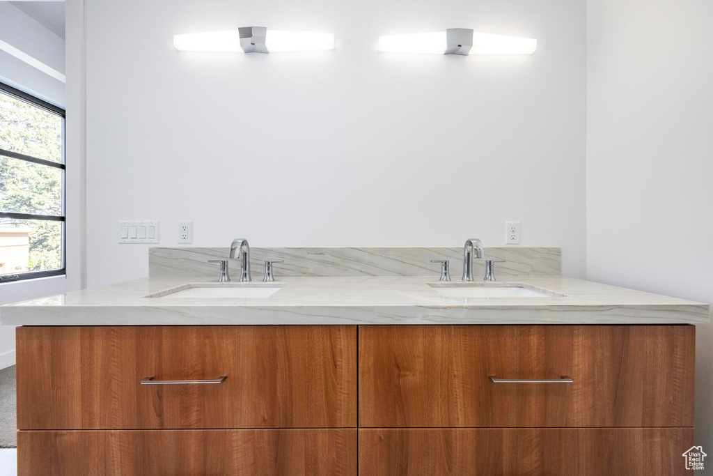 Bathroom with vanity and plenty of natural light