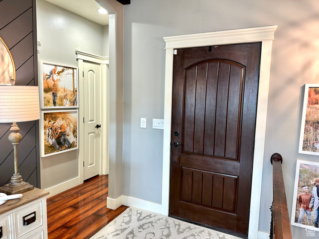 Foyer with dark wood-type flooring