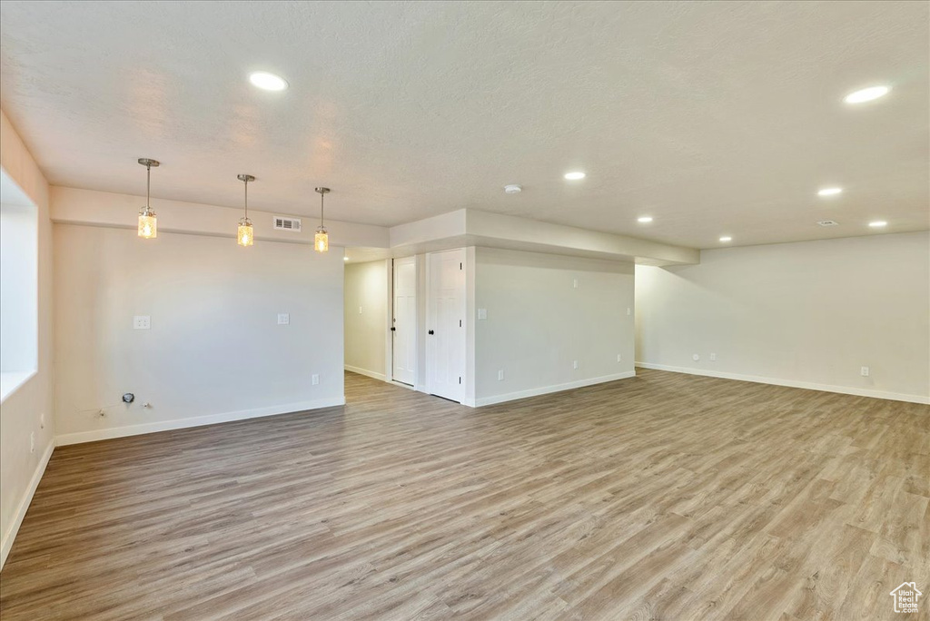 Unfurnished room with light wood-type flooring