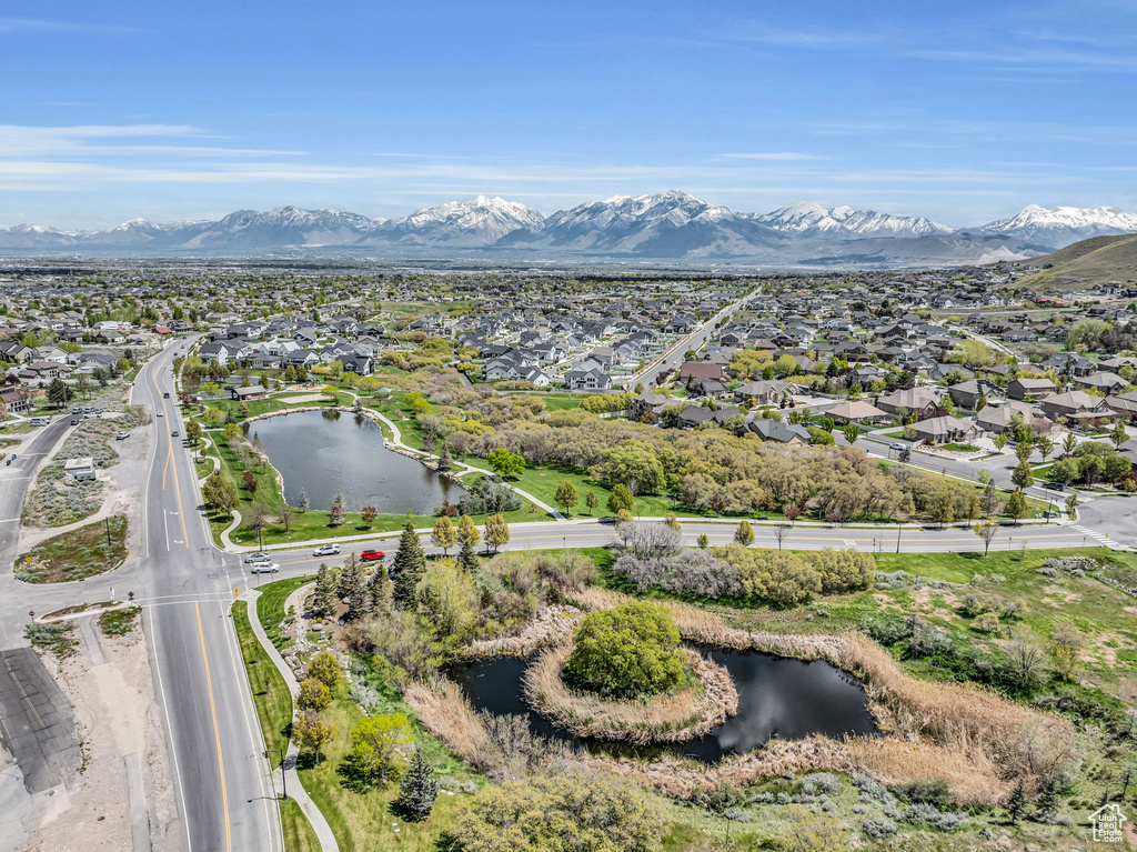 Aerial view featuring a water and mountain view