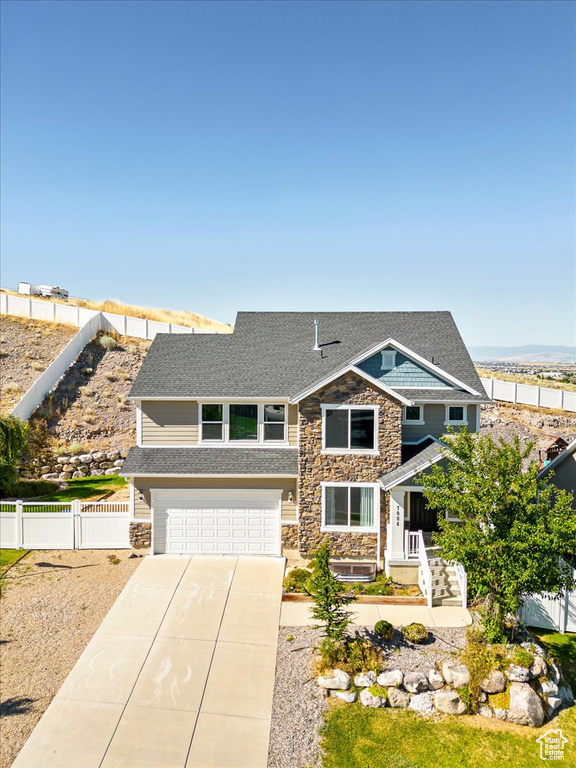 View of front of property featuring a garage