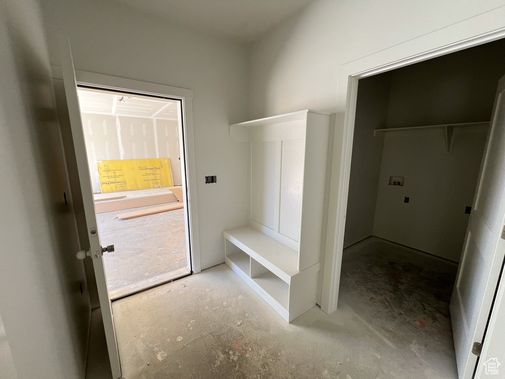 Mudroom featuring concrete floors