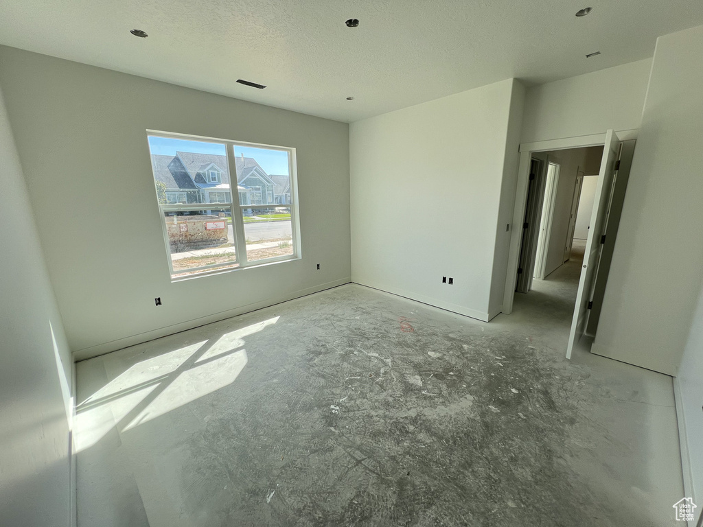 Unfurnished bedroom featuring a textured ceiling