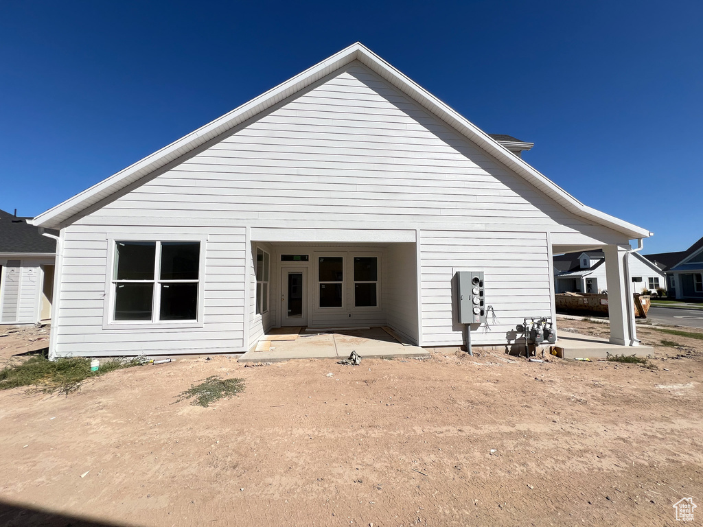 Rear view of property with a patio area