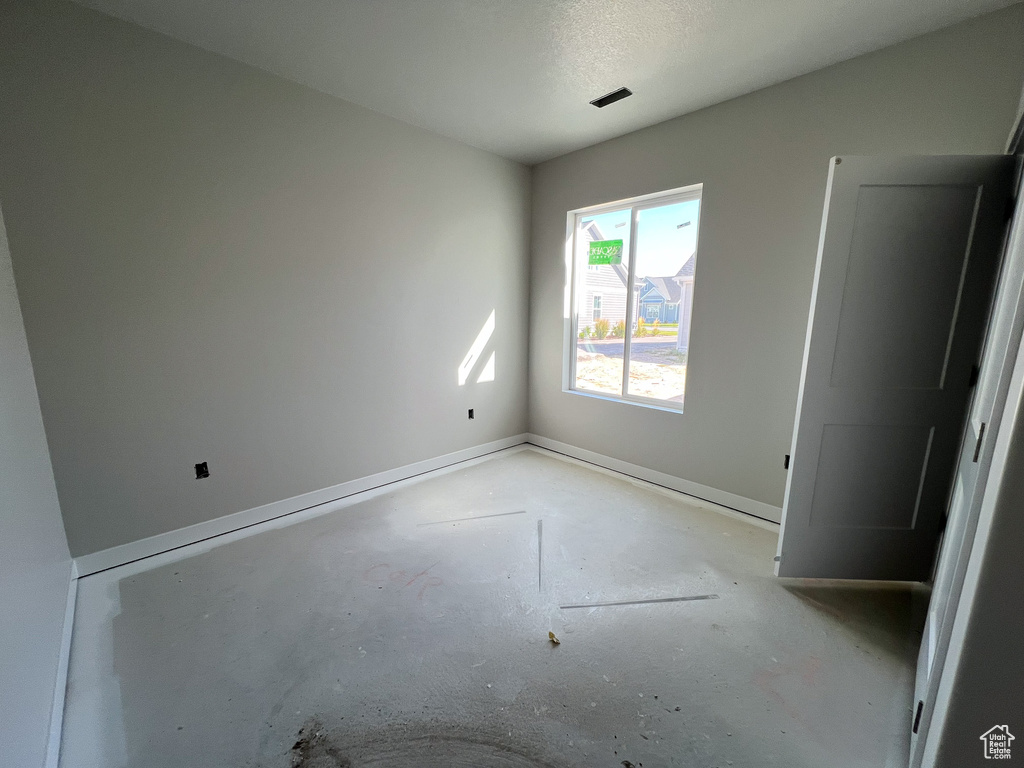 Spare room with a textured ceiling