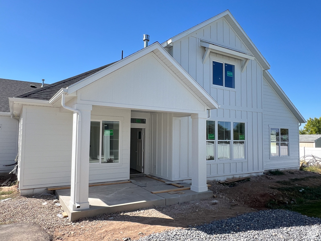 Back of house with a patio