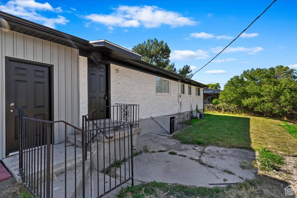 View of home's exterior featuring a yard