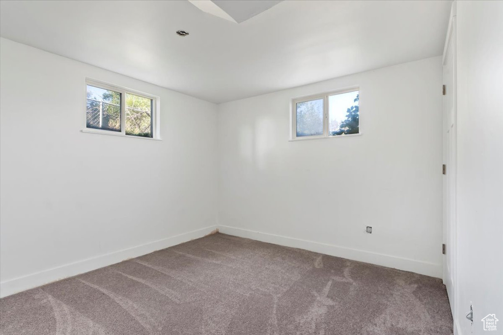 Empty room with carpet flooring