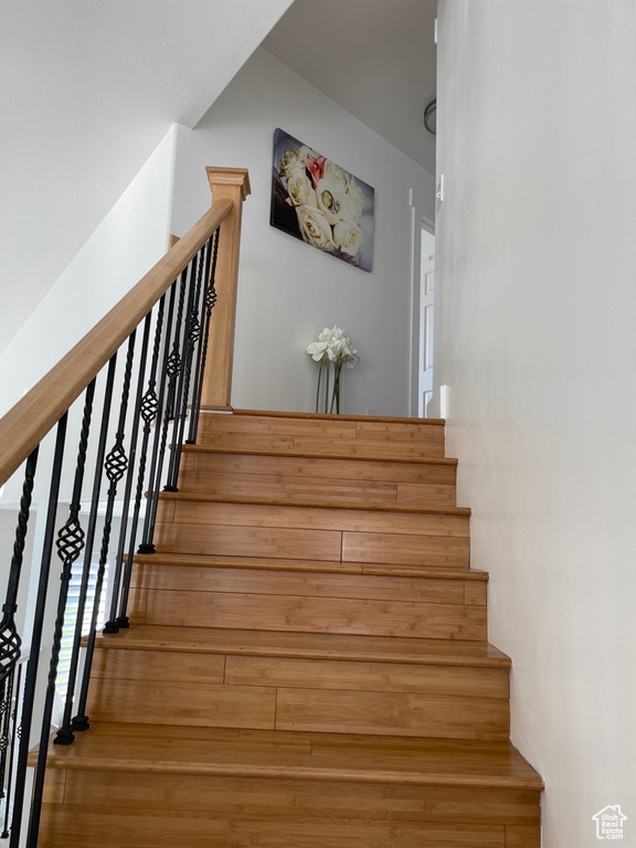 Stairway with hardwood / wood-style flooring